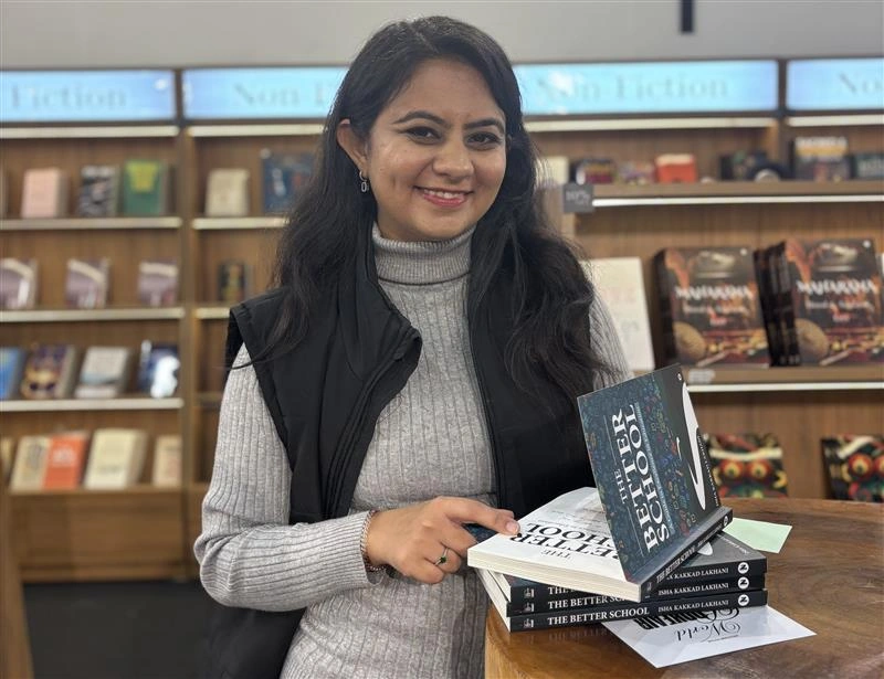 Isha Kakkad Lakhani with copies of The Better School